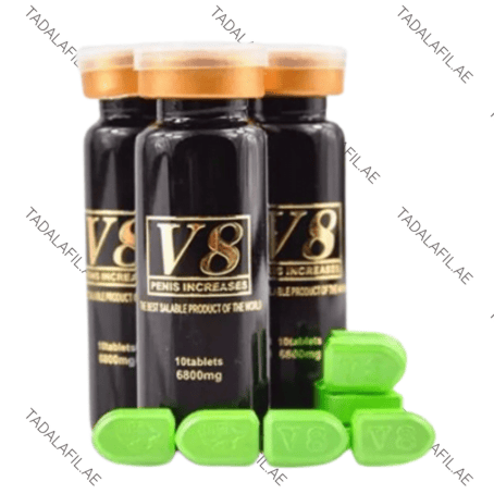 V8 Pills for Sex Delay bottles and green tablets on white background