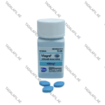 Viagra 100mg bottle and blue tablets on white background